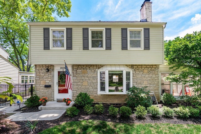 2008 N Edgemont Rd, Upper Arlington, OH 43212 - colonial-style house featuring a chimney and stone siding