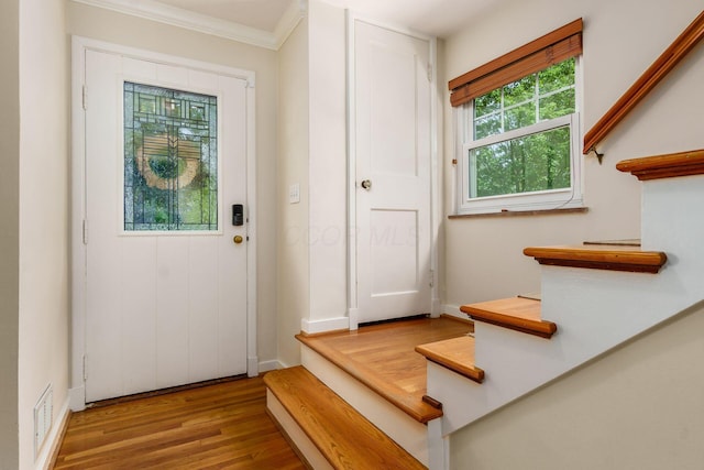 2008 N Edgemont Rd, Upper Arlington, OH 43212 - foyer with wood finished floors, ornamental molding, stairway, and baseboards