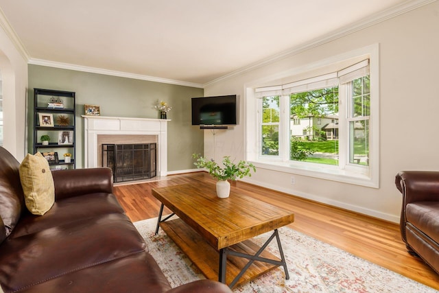 2008 N Edgemont Rd, Upper Arlington, OH 43212 - living room with crown molding, wood finished floors, baseboards, a fireplace with flush hearth, and arched walkways