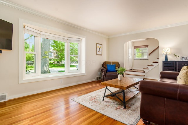 2008 N Edgemont Rd, Upper Arlington, OH 43212 - living room with crown molding, wood finished floors, arched walkways, baseboards, and stairs