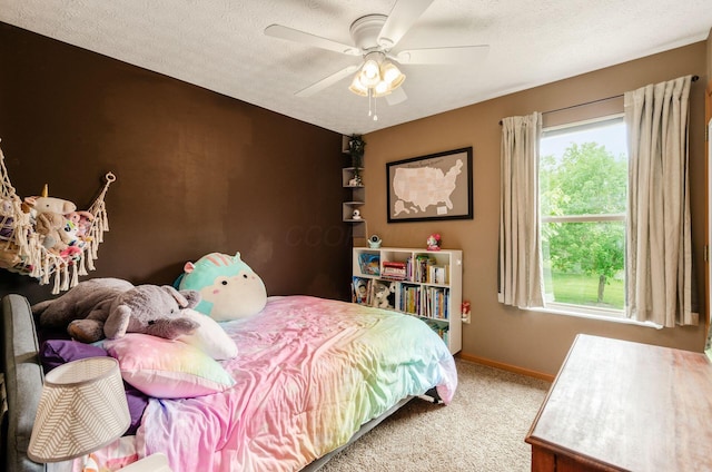 6249 Corley Dr, Dublin, OH 43016 - carpeted bedroom with baseboards, ceiling fan, and a textured ceiling
