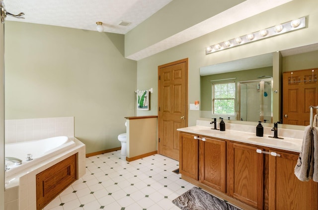 6249 Corley Dr, Dublin, OH 43016 - bathroom featuring a shower stall, a bath, double vanity, tile patterned floors, and toilet