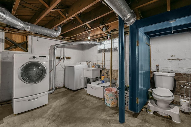297 S James Rd, Columbus, OH 43213 - unfinished below grade area featuring washer and clothes dryer and a sink