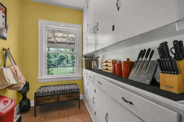 297 S James Rd, Columbus, OH 43213 - mudroom featuring baseboards and brick patterned flooring