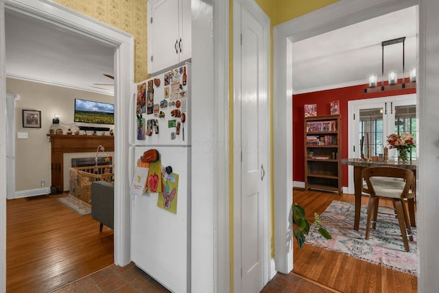 297 S James Rd, Columbus, OH 43213 - corridor featuring ornamental molding, wood finished floors, and baseboards