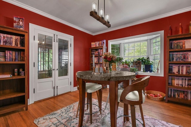 297 S James Rd, Columbus, OH 43213 - dining room featuring french doors, wood finished floors, ornamental molding, and baseboards