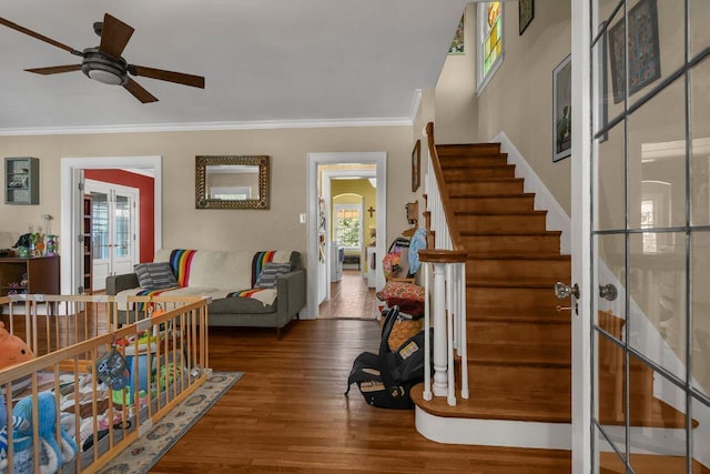 297 S James Rd, Columbus, OH 43213 - foyer entrance featuring crown molding, ceiling fan, french doors, wood finished floors, and stairs