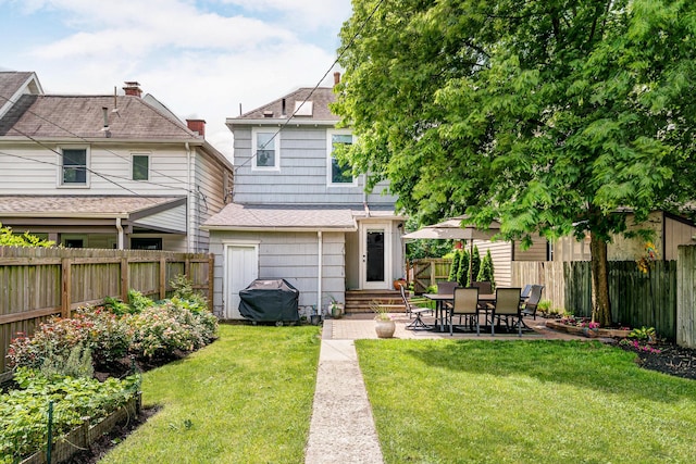 432 E Kossuth St, Columbus, OH 43206 - rear view of house featuring entry steps, a shingled roof, and a patio