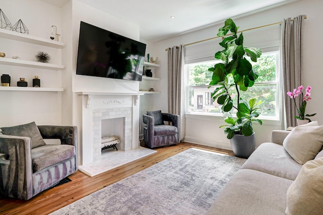 432 E Kossuth St, Columbus, OH 43206 - living room featuring wood finished floors and a brick fireplace