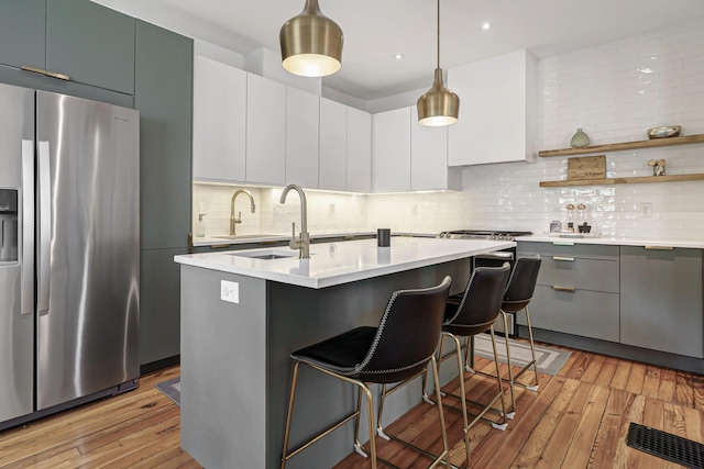 432 E Kossuth St, Columbus, OH 43206 - kitchen featuring stainless steel refrigerator with ice dispenser, light countertops, modern cabinets, and recessed lighting