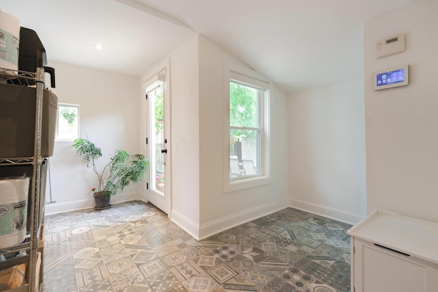 432 E Kossuth St, Columbus, OH 43206 - foyer featuring baseboards and lofted ceiling