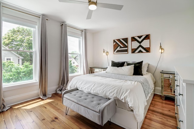 432 E Kossuth St, Columbus, OH 43206 - bedroom featuring multiple windows, light wood finished floors, and baseboards