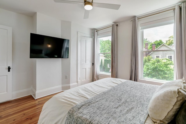 432 E Kossuth St, Columbus, OH 43206 - bedroom with wood finished floors, baseboards, and a ceiling fan