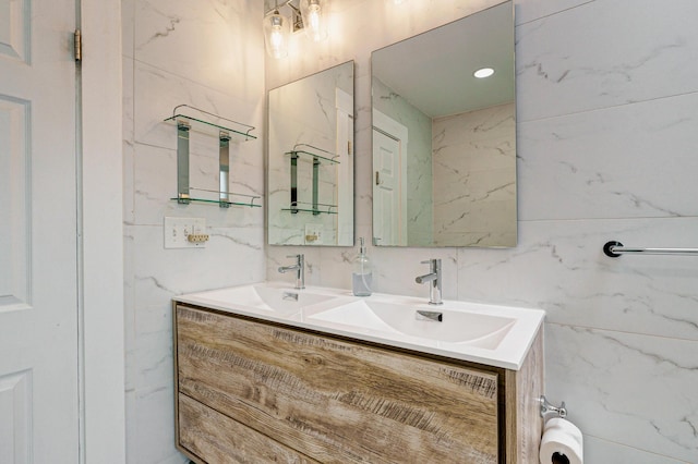 432 E Kossuth St, Columbus, OH 43206 - bathroom featuring tile walls and double vanity