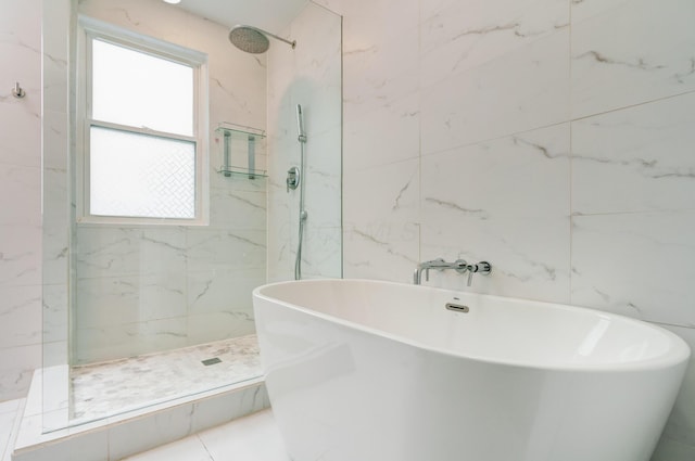 432 E Kossuth St, Columbus, OH 43206 - full bathroom with healthy amount of natural light, a marble finish shower, and a freestanding bath