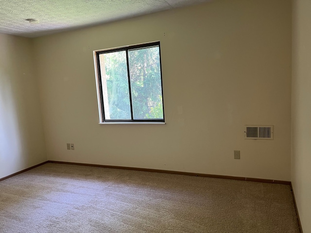 3965 Karl Rd Unit 200, Columbus, OH 43224 - carpeted empty room featuring baseboards and a textured ceiling