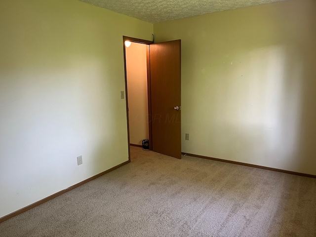 3965 Karl Rd Unit 200, Columbus, OH 43224 - unfurnished room featuring carpet floors, a textured ceiling, and baseboards