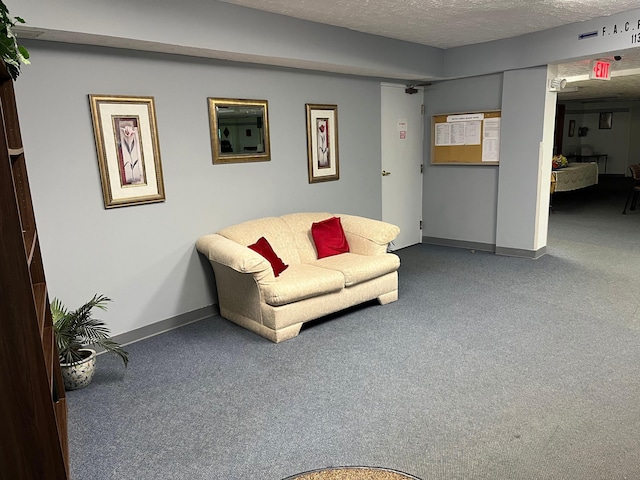 3965 Karl Rd Unit 200, Columbus, OH 43224 - living room featuring carpet flooring, a textured ceiling, and baseboards