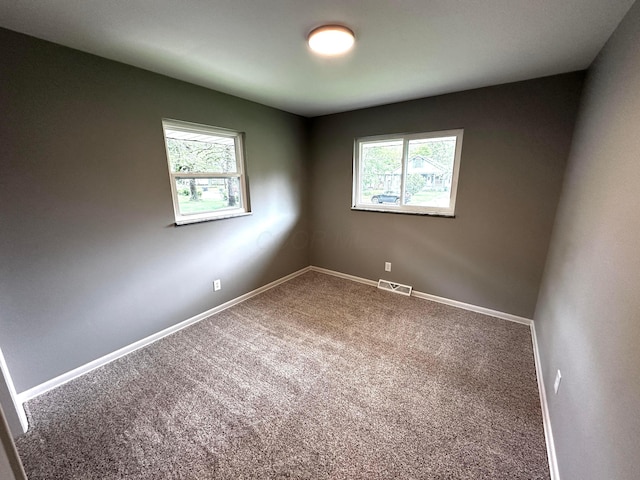 239 Maplewood Ave, Columbus, OH 43213 - empty room with plenty of natural light, carpet floors, and baseboards