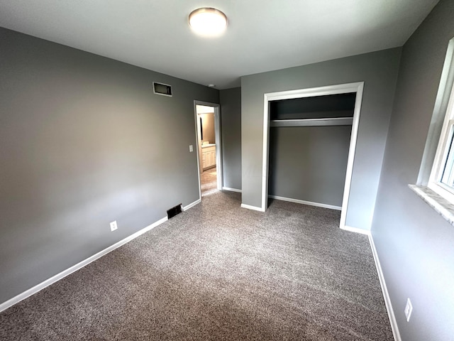 239 Maplewood Ave, Columbus, OH 43213 - unfurnished bedroom featuring carpet, baseboards, and a closet