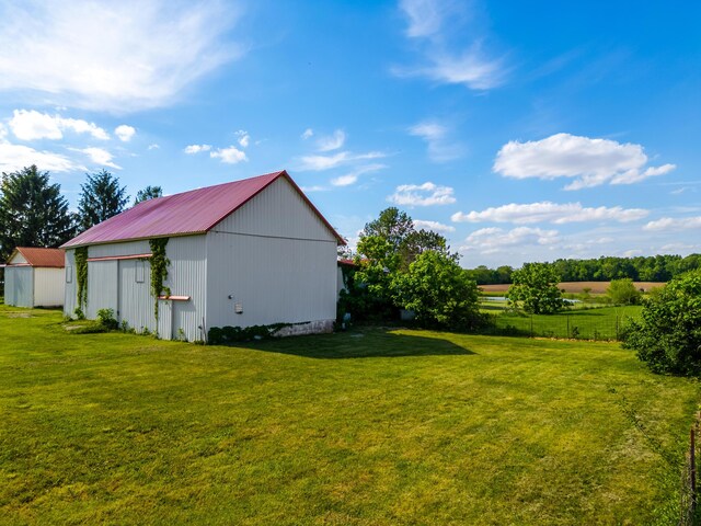 4842 State Route 734, Jeffersonville, OH 43128 - view of green lawn with a pole building and an outbuilding