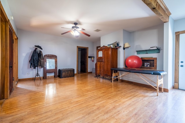 4842 State Route 734, Jeffersonville, OH 43128 - exercise room featuring wood finished floors, ceiling fan, and baseboards