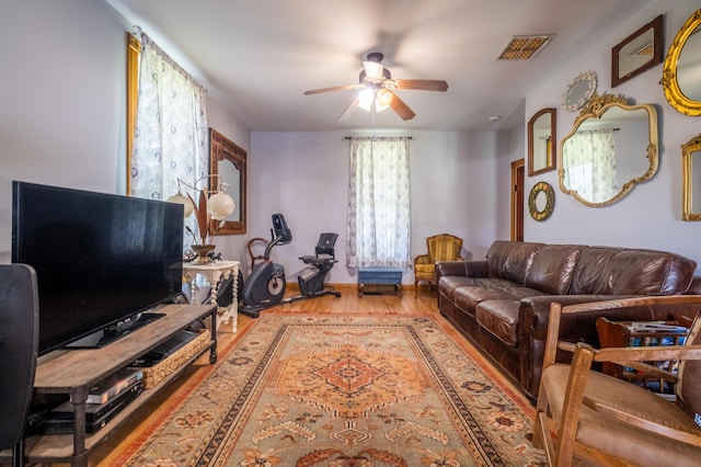 4842 State Route 734, Jeffersonville, OH 43128 - living room featuring ceiling fan, wood finished floors, and baseboards