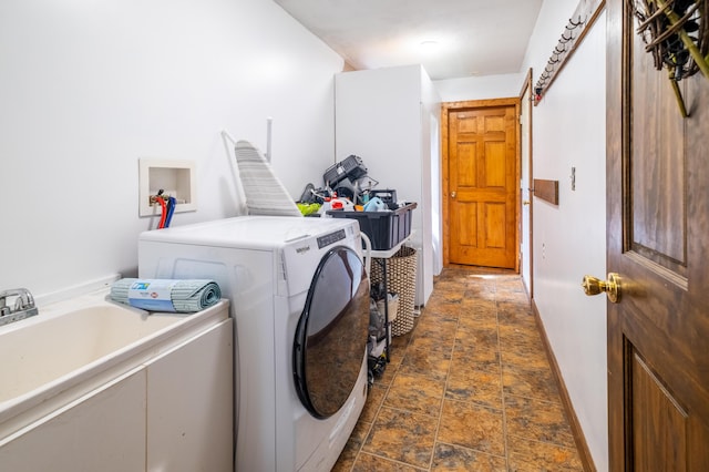 4842 State Route 734, Jeffersonville, OH 43128 - washroom with dark stone finish floors, independent washer and dryer, and baseboards