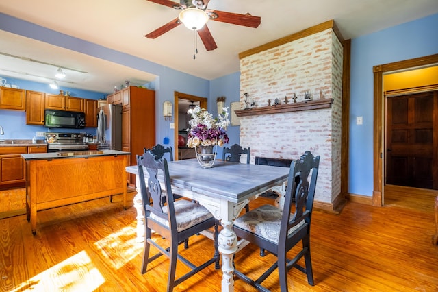 4842 State Route 734, Jeffersonville, OH 43128 - dining area featuring light wood finished floors, ceiling fan, and baseboards