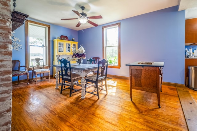 4842 State Route 734, Jeffersonville, OH 43128 - dining room featuring a ceiling fan, wood finished floors, and baseboards