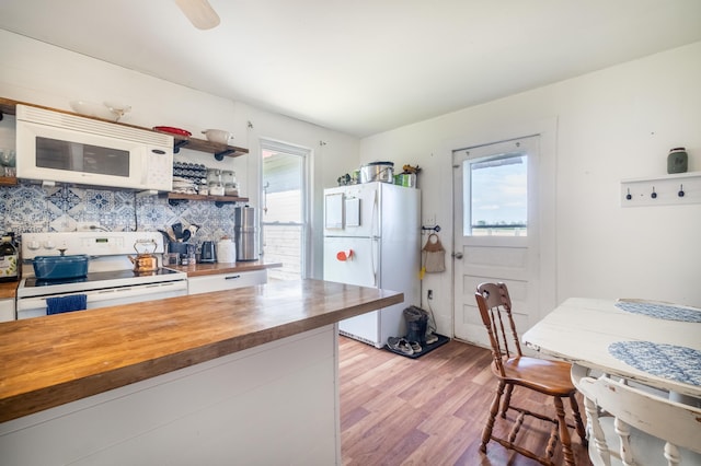 4842 State Route 734, Jeffersonville, OH 43128 - kitchen with wooden counters, white appliances, light wood-style floors, tasteful backsplash, and open shelves