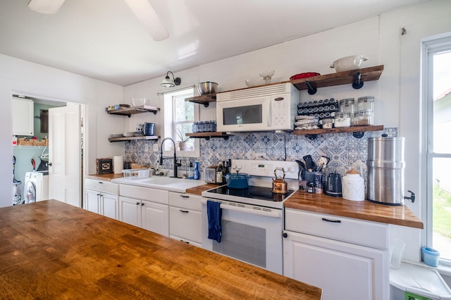 4842 State Route 734, Jeffersonville, OH 43128 - kitchen featuring open shelves, white appliances, wood counters, a sink, and backsplash