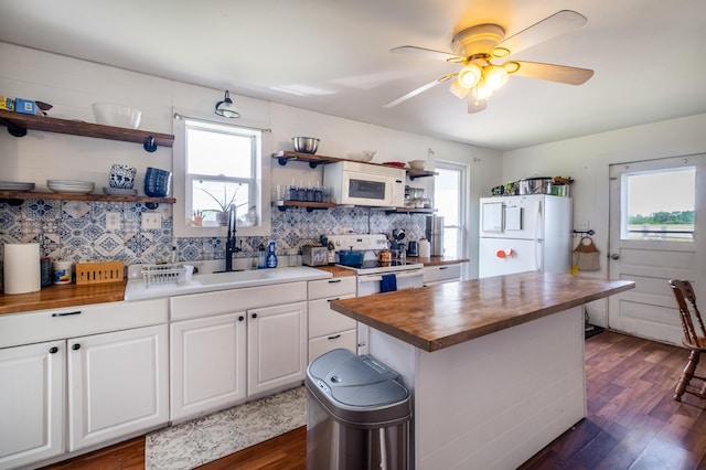 4842 State Route 734, Jeffersonville, OH 43128 - kitchen with white appliances, wood counters, open shelves, dark wood-style flooring, and a sink
