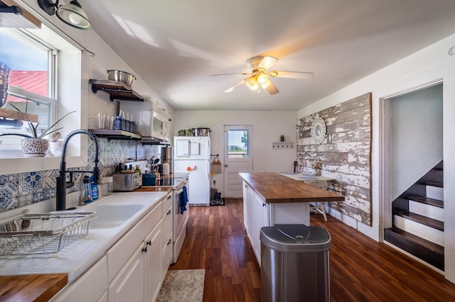 4842 State Route 734, Jeffersonville, OH 43128 - kitchen featuring wood counters, open shelves, white cabinetry, white appliances, and dark wood finished floors