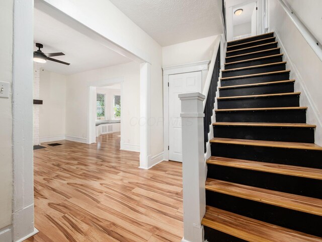 534 Berkeley Rd, Columbus, OH 43205 - staircase featuring wood finished floors, ceiling fan, and baseboards