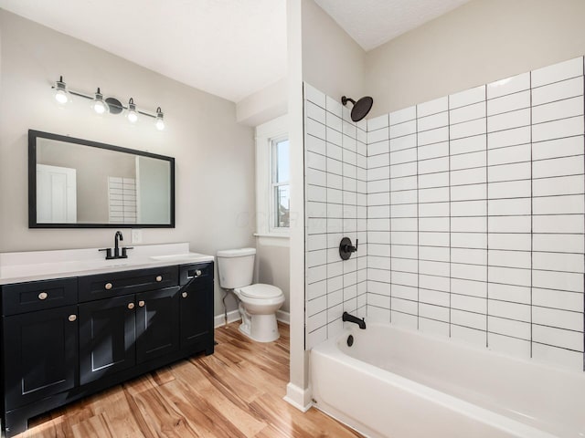 534 Berkeley Rd, Columbus, OH 43205 - full bath featuring wood finished floors, toilet, vanity,  shower combination, and baseboards