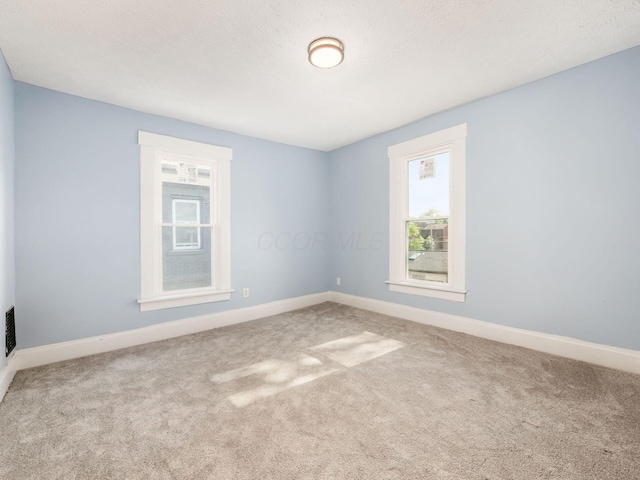 534 Berkeley Rd, Columbus, OH 43205 - carpeted empty room with healthy amount of natural light and baseboards
