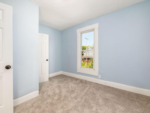 534 Berkeley Rd, Columbus, OH 43205 - carpeted spare room with baseboards and vaulted ceiling
