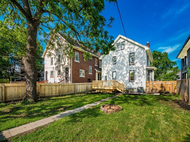 534 Berkeley Rd, Columbus, OH 43205 - rear view of house featuring a chimney, a wooden deck, and cooling unit