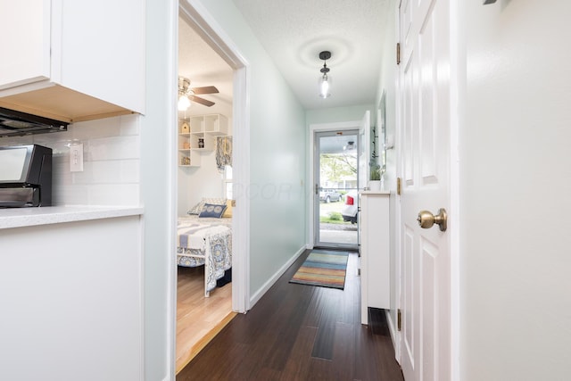 11177 Sassafrass Rd, Lakeview, OH 43331 - hallway with dark wood finished floors and baseboards