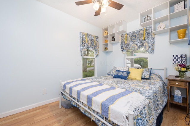 11177 Sassafrass Rd, Lakeview, OH 43331 - bedroom featuring wood finished floors, baseboards, and ceiling fan