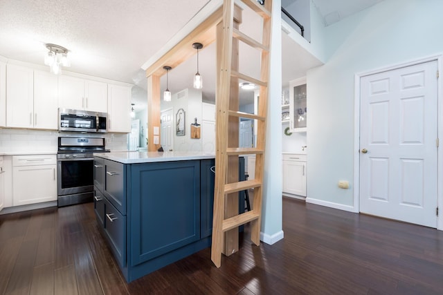 11177 Sassafrass Rd, Lakeview, OH 43331 - kitchen with stainless steel appliances, white cabinetry, light countertops, decorative backsplash, and a textured ceiling