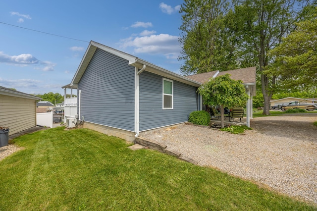 11177 Sassafrass Rd, Lakeview, OH 43331 - view of side of property featuring a yard and a patio