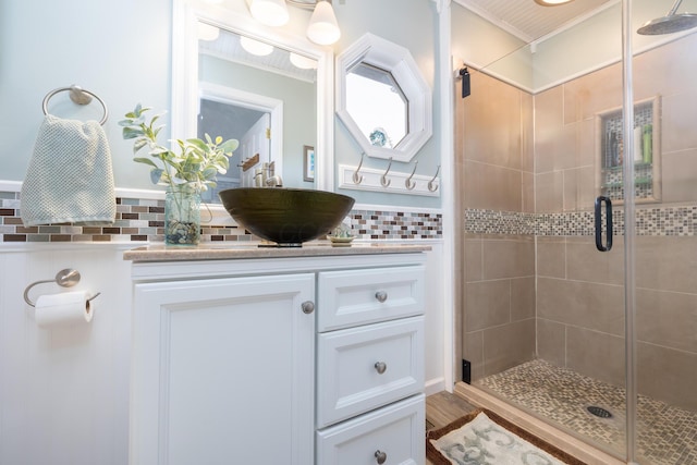 11177 Sassafrass Rd, Lakeview, OH 43331 - full bath featuring a shower stall, vanity, and decorative backsplash