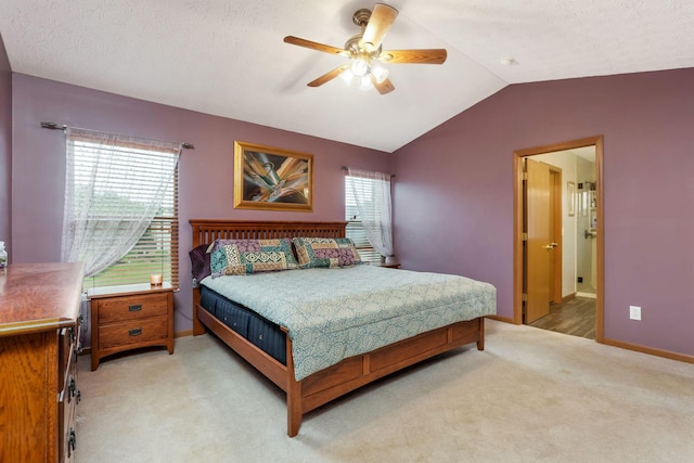 5409 Wellcrest Ct, Galloway, OH 43119 - bedroom with light colored carpet, vaulted ceiling, baseboards, a ceiling fan, and connected bathroom