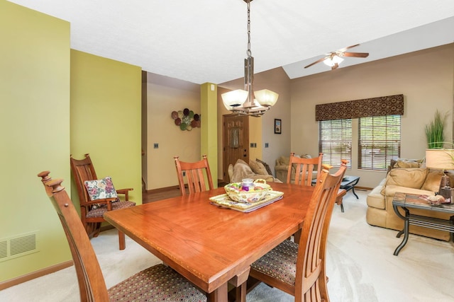5409 Wellcrest Ct, Galloway, OH 43119 - dining space with light colored carpet, a chandelier, a ceiling fan, baseboards, and vaulted ceiling