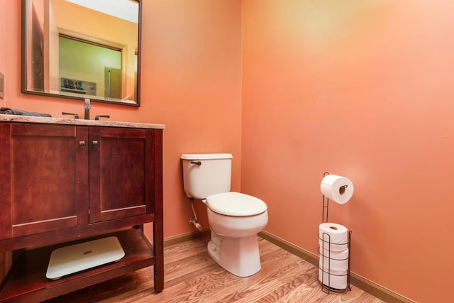 5409 Wellcrest Ct, Galloway, OH 43119 - bathroom featuring toilet, wood finished floors, vanity, and baseboards