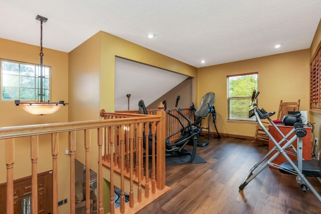 5409 Wellcrest Ct, Galloway, OH 43119 - workout room featuring wood finished floors, plenty of natural light, recessed lighting, baseboards, and a textured ceiling