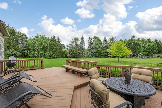 5409 Wellcrest Ct, Galloway, OH 43119 - deck with a lawn, a playground, and view of wooded area