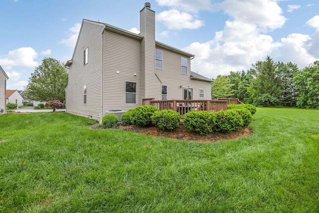 5409 Wellcrest Ct, Galloway, OH 43119 - back of house featuring a chimney, a wooden deck, a yard, and central AC unit